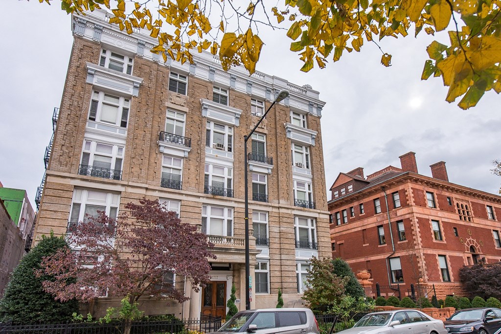 exterior of brick apartment building at dupont apartments in washington dc
