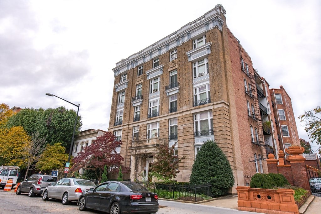 exterior of brick apartment building at dupont apartments in washington dc