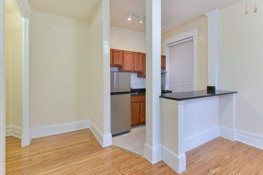 view of kitchen with stainless steel appliances and breakfast bar at dupont apartments in washington dc