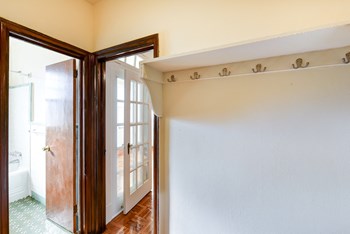view of bathroom and custom shelving in hallway of eddystone apartments in washington dc - Photo Gallery 11