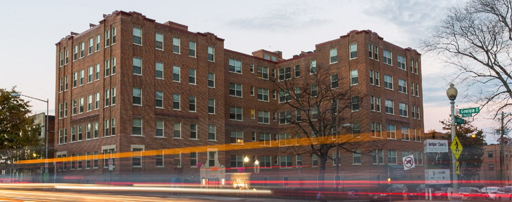 exterior of brick apartment building at juniper courts in washington dc