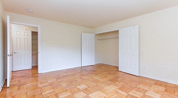 bedroom with wood flooring at fort totten apartments in washington dc
