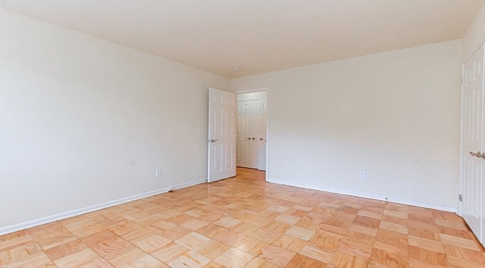 bedroom with wood flooring at fort totten apartments in washington dc