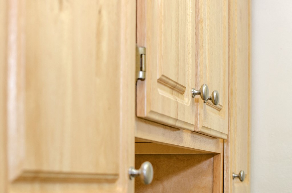 close of up oak wood kitchen cabinetry at fort totten apartments in washington dc