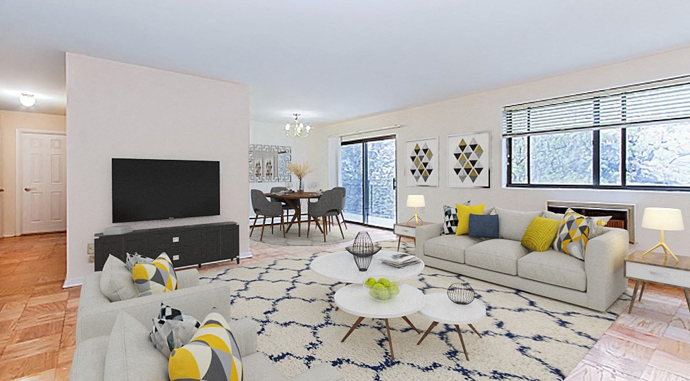 living area with sofa, coffee table, tv, credenza large windows and view of dining area at fort totten apartments in washington dc