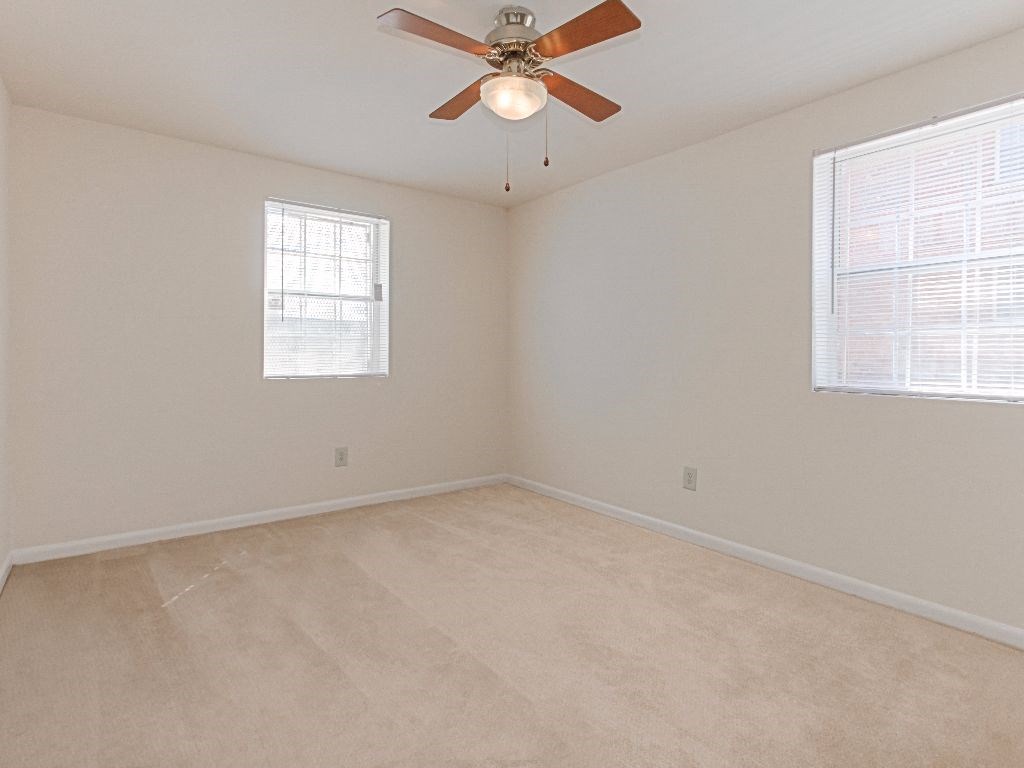 living area with carpeting and ceiling fan at grandview village apartments in shipley terrace washington dc