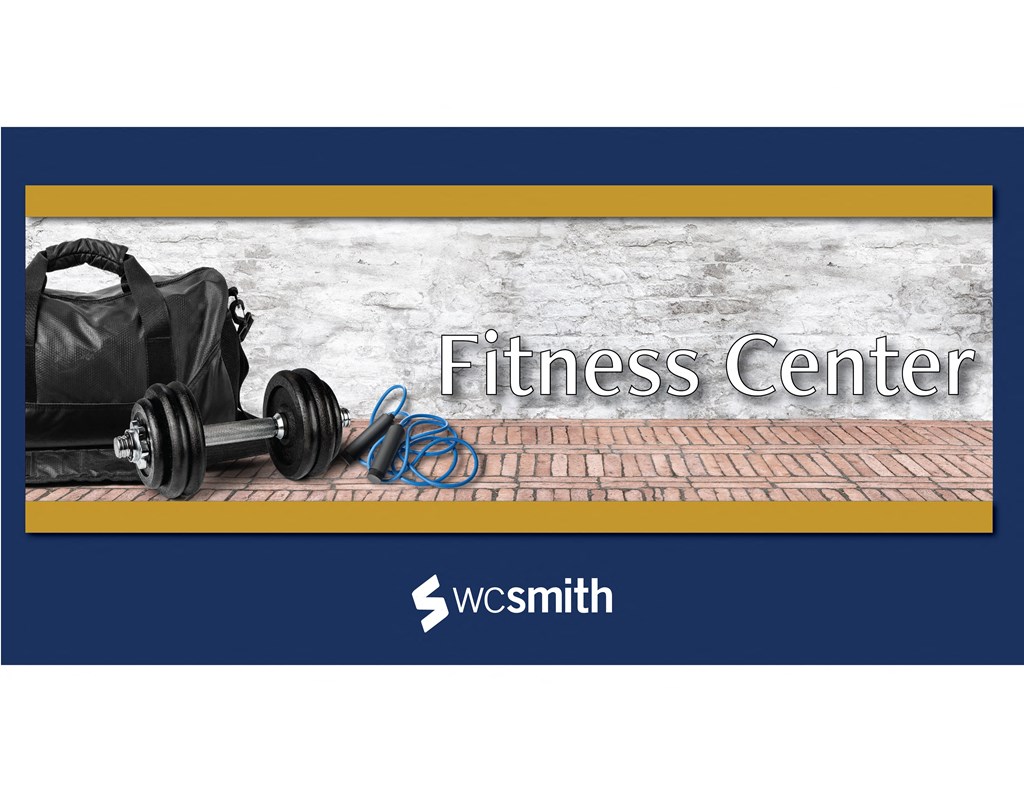 the fitness center logo with a bag on the ground