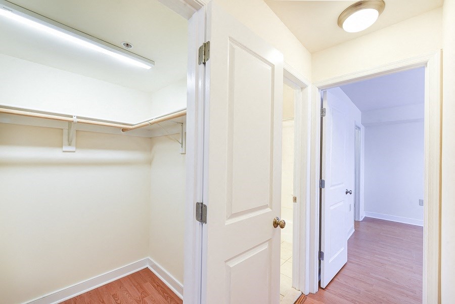 hallway view of closet and bedroom with wood flooring at jasper place apartments in congress heights washington dc