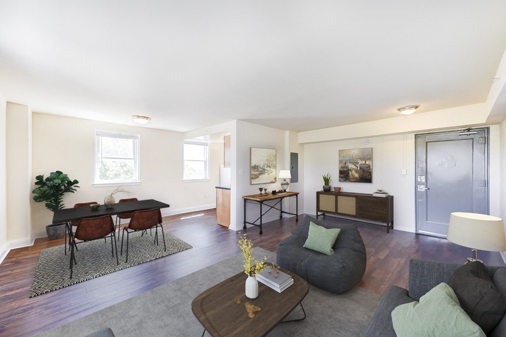 a living room aom with a couch and a table at 734 longfellow tax credit apartments in washington dc