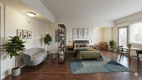 A modern bedroom with a large bed and a grey sofa.