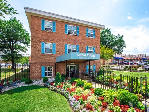 exterior brick view of manor village  tax credit apartments in washington dc