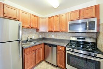 kitchen with stainless steel appliances at naylor overlook apartments in skyland washington dc