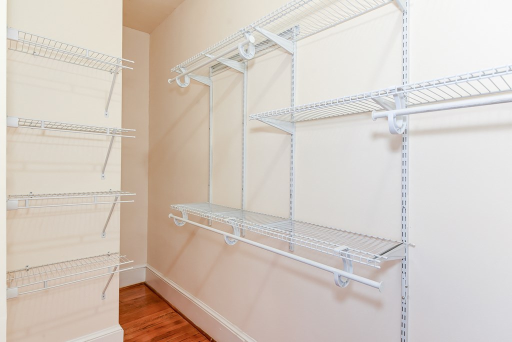 closet with custom shelving and hardwood floors at norwood apartments in washington dc