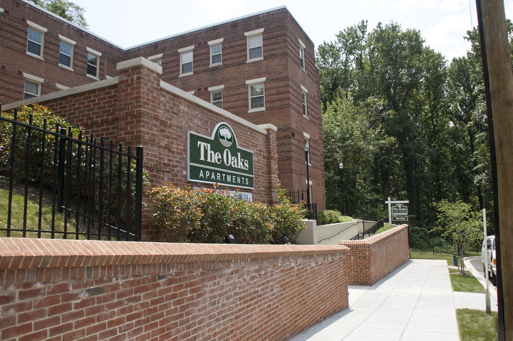 brick exterior of the oaks apartments in washington dc
