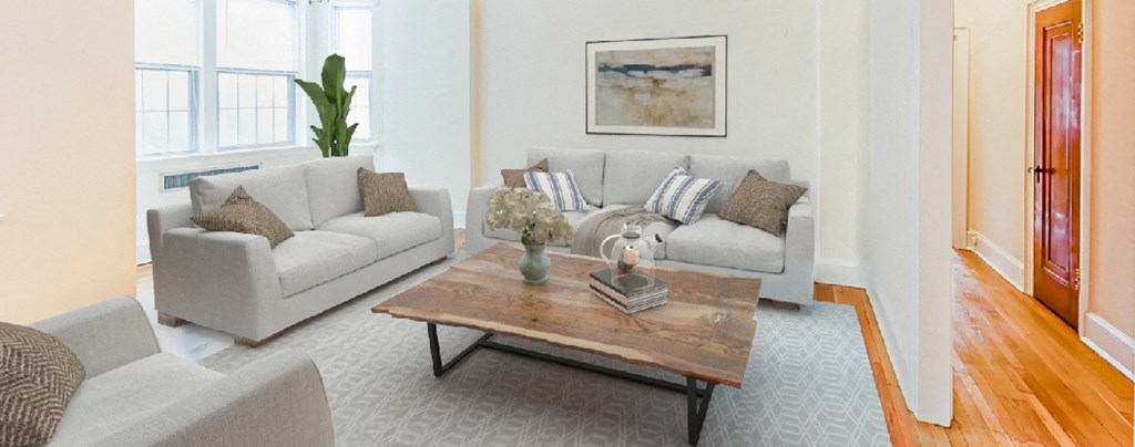 living area with sofa, coffee table, hardwood floors, large windows and ceiling fan  at 2800 ontario road apartments in washington dc