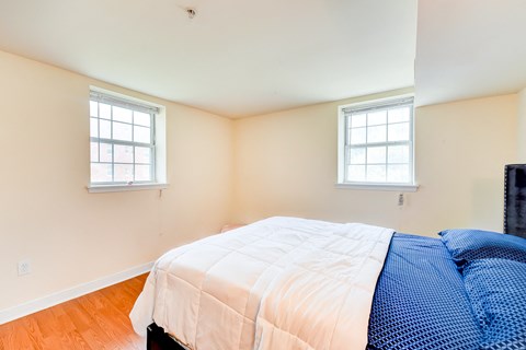 bedroom with large windows at park vista apartments in washington dc