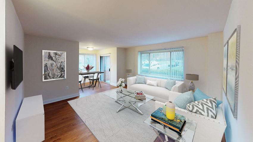 living area with sofa, coffee table, side chair, large windows and view of dining area at penn view apartments in washington dc. - Photo Gallery