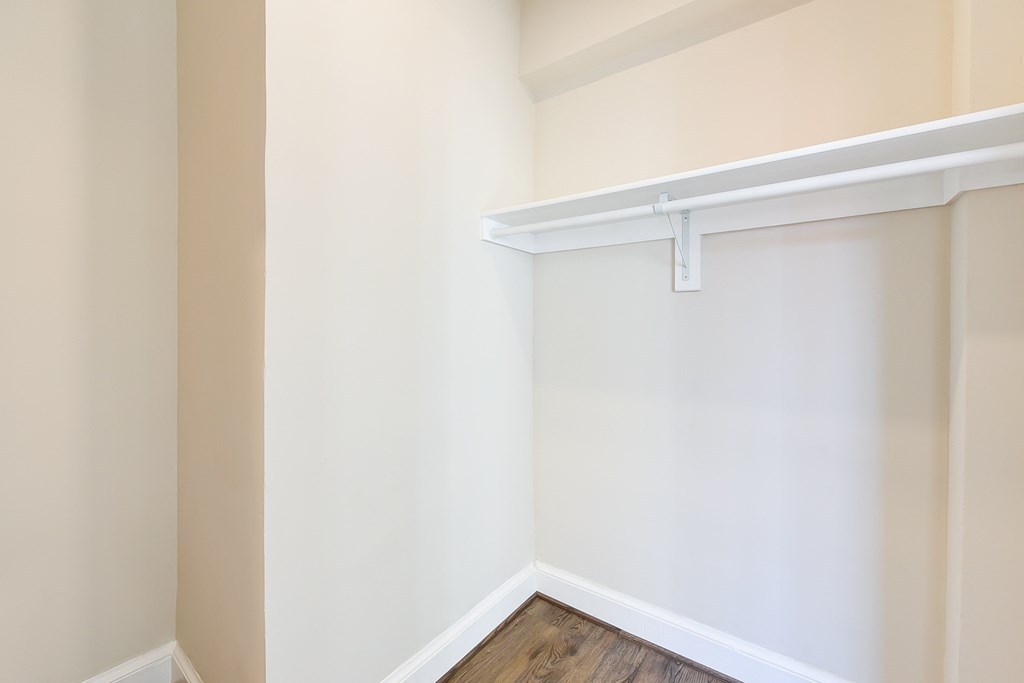 large walk in closet with shelving at petworth station apartments in washington dc
