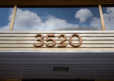 exterior view of building number at Alpha house apartments in washington dc