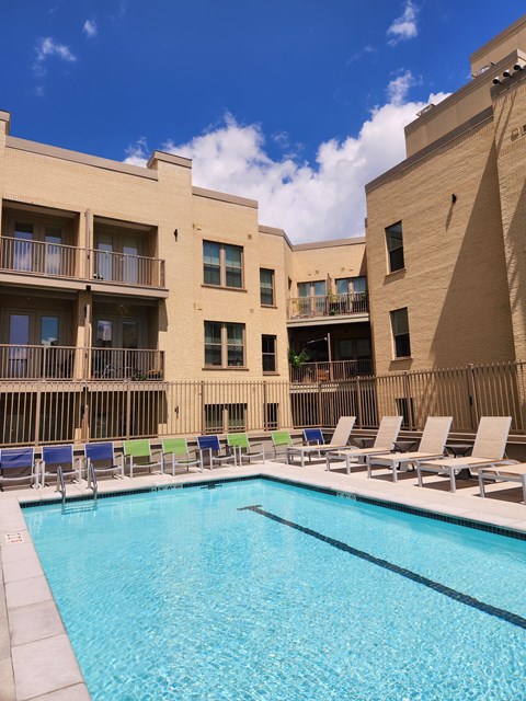 our apartments have a large pool and lounge chairs