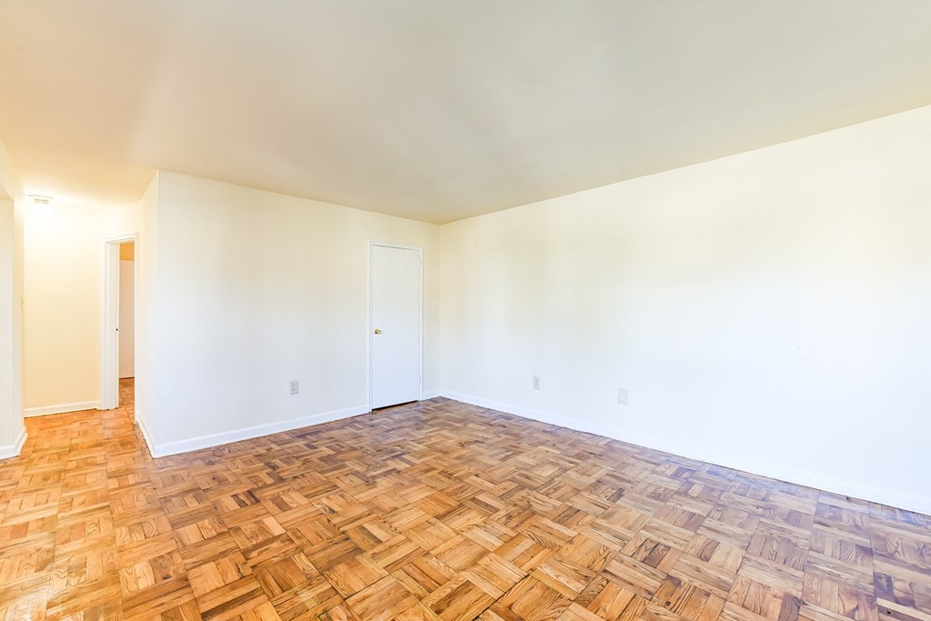 vacant living area with hardwood flooring at richman apartments in washington dc