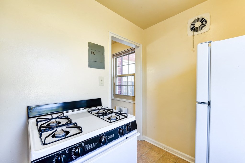 kitchen with white appliances at richman apartments in washington dc