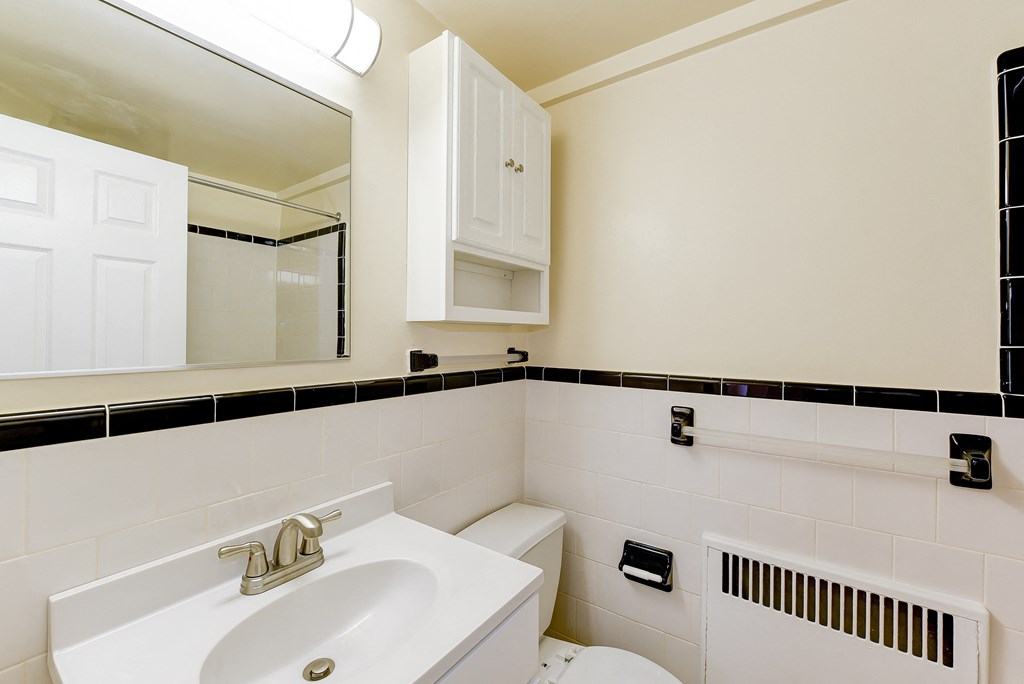 bathroom with sink, mirror medicine cabinet and tile detail at sherry hall in washington dc