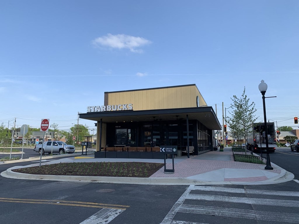 a starbucks store on the corner of a city street