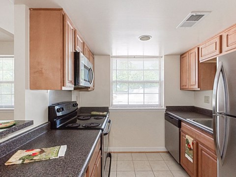 a kitchen with a stove and a refrigerator