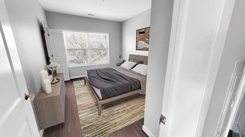 a bedroom with a bed and a window
