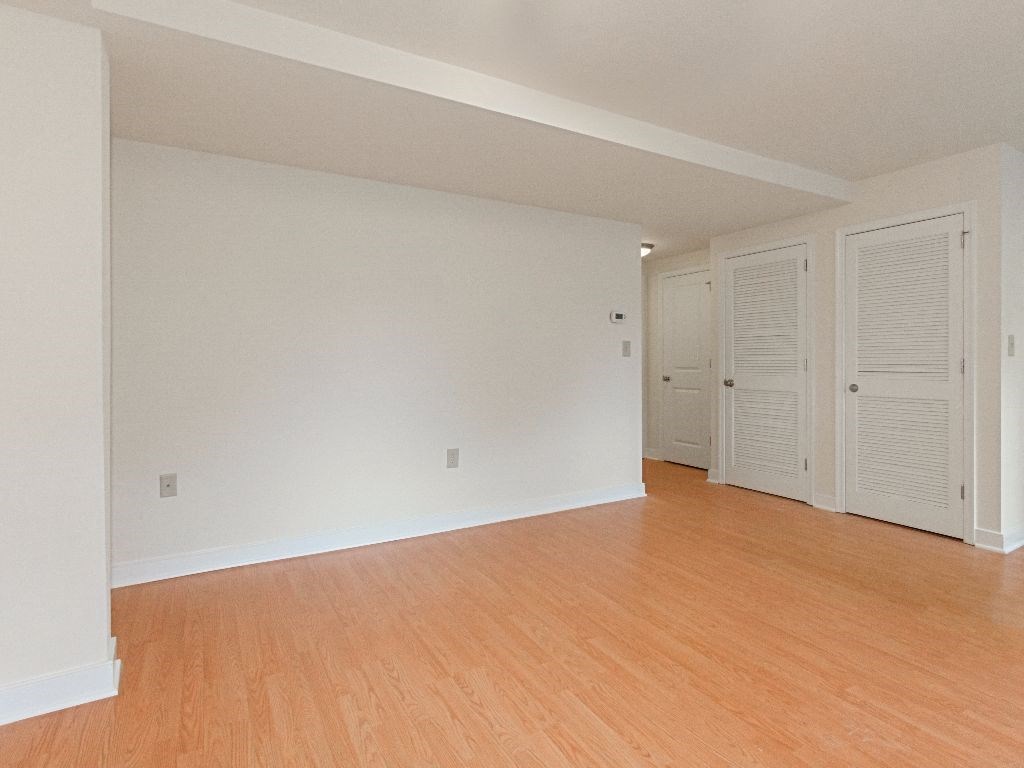 living area with hardwood flooring at the oaks apartments in washington dc