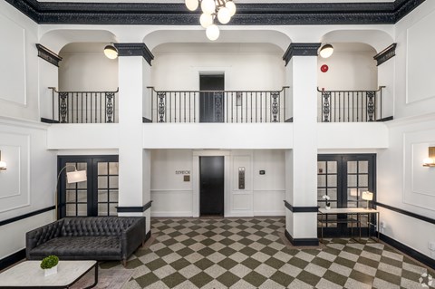 A black and white checkered floor in a spacious room.
