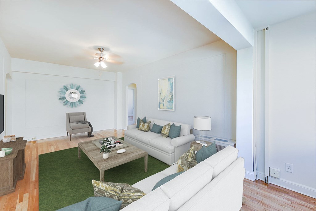 living area with sofa, coffee table, sitting area, hardwood flooring, and ceiling fan at the frontenac apartments in washington dc