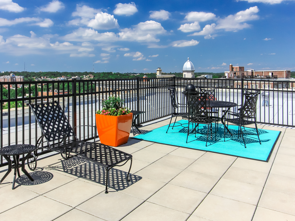 rooftop lounge with lounge chairs, social seating and tables at the norwood apartments in adams morgan washington dc