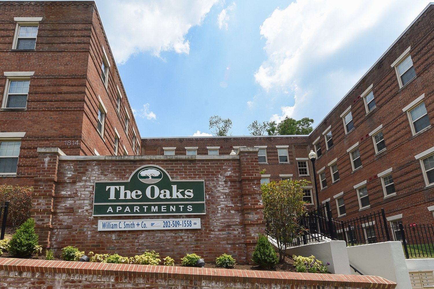 brick exterior of the oaks apartments in washington dc