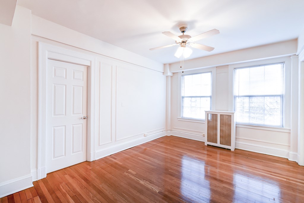 living area with hardwood floors and ceiling fan at wakefield hall apartments in u street washington dc