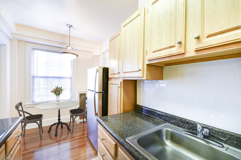 kitchen with view of dining area at wakefield hall apartments in washington dc