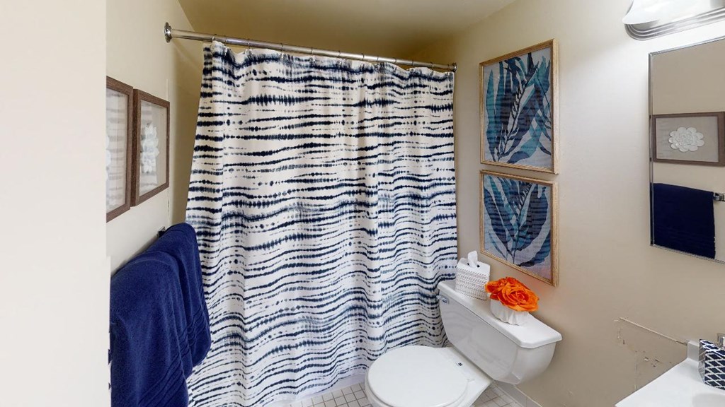 bathroom with tub, toilet and towel rack at washington view apartments in southeast dc