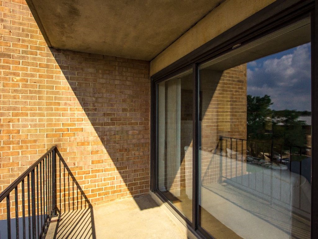 large balcony with sliding doors to inside of apartment at washington view apartments in south east washington dc