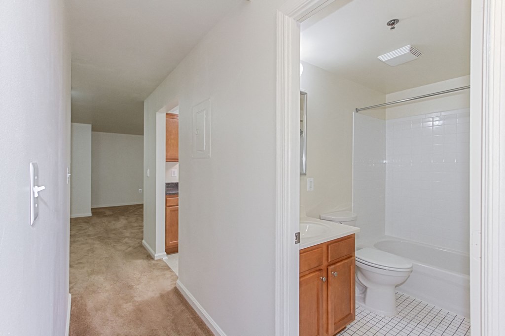 hallway view of kitchen and bathroom at whitelaw apartments in washington dc