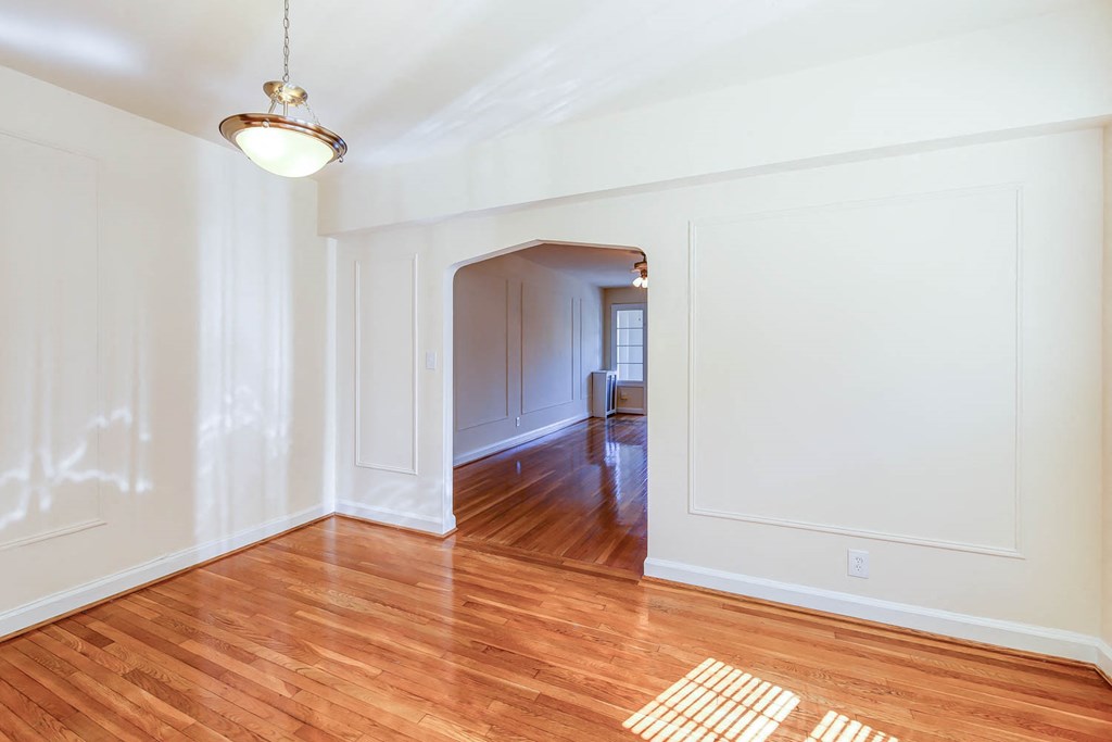 vacant dining area with hardwood floors at the frontenac apartments in van ness washington dc