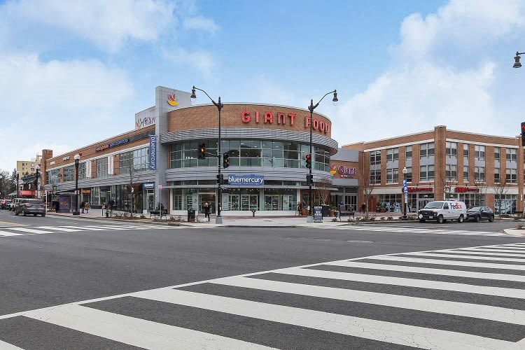 Spacious, landscaped outdoor terrace with lush seating, grills and a fire pit