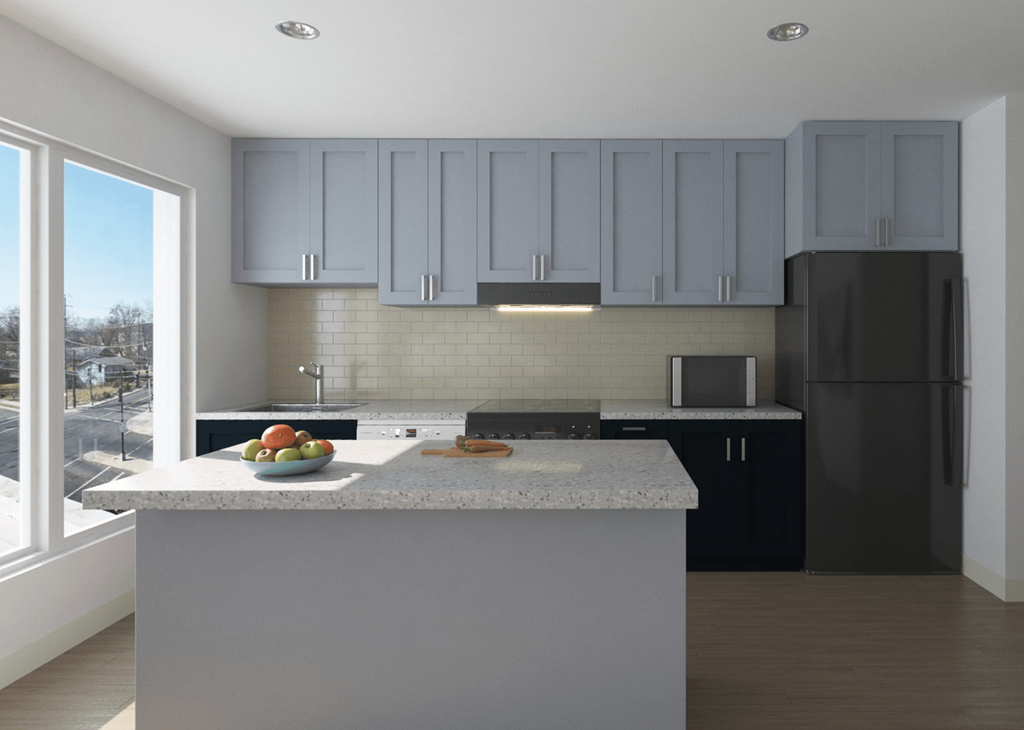 kitchen with large windows and kitchen island at the strand apartments in hillbrook deanwood washington dc