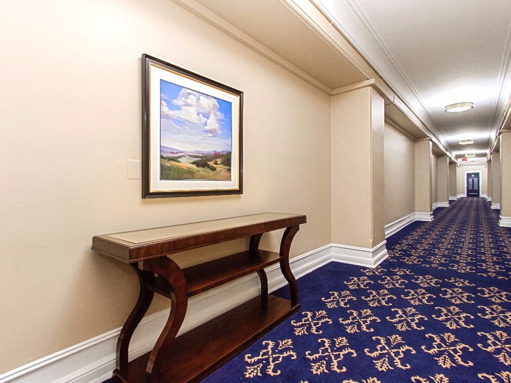 hallway with a bench and a painting on the wall at the calverton apartments in washington dc