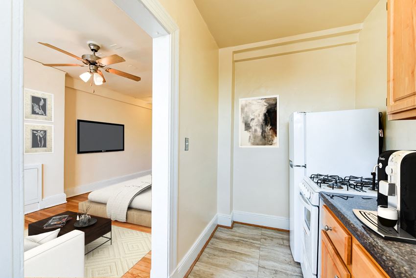 kitchen with gas range, wood cabinetry and energy efficient appliances at the foreland apartments in washinton dc - Photo Gallery