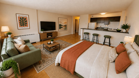 A bedroom with a large bed and a couch.