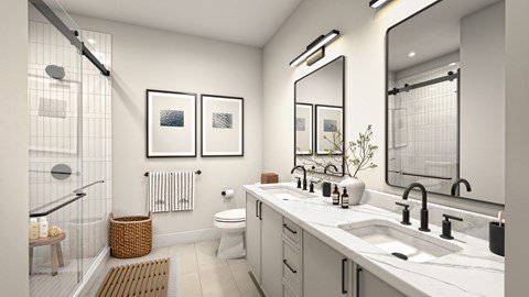 A modern bathroom with a glass shower enclosure and a white toilet.