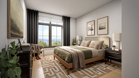 A bedroom with a large bed and a view of the ocean.