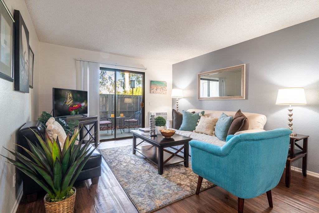 our apartments offer a living room with a couch and a tv