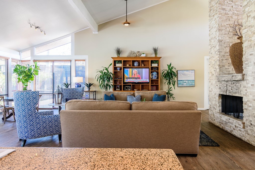 A living room with a fireplace and a couch.